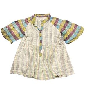 Perfect in plaid baby doll-inspired design with puff sleeves for added shape.